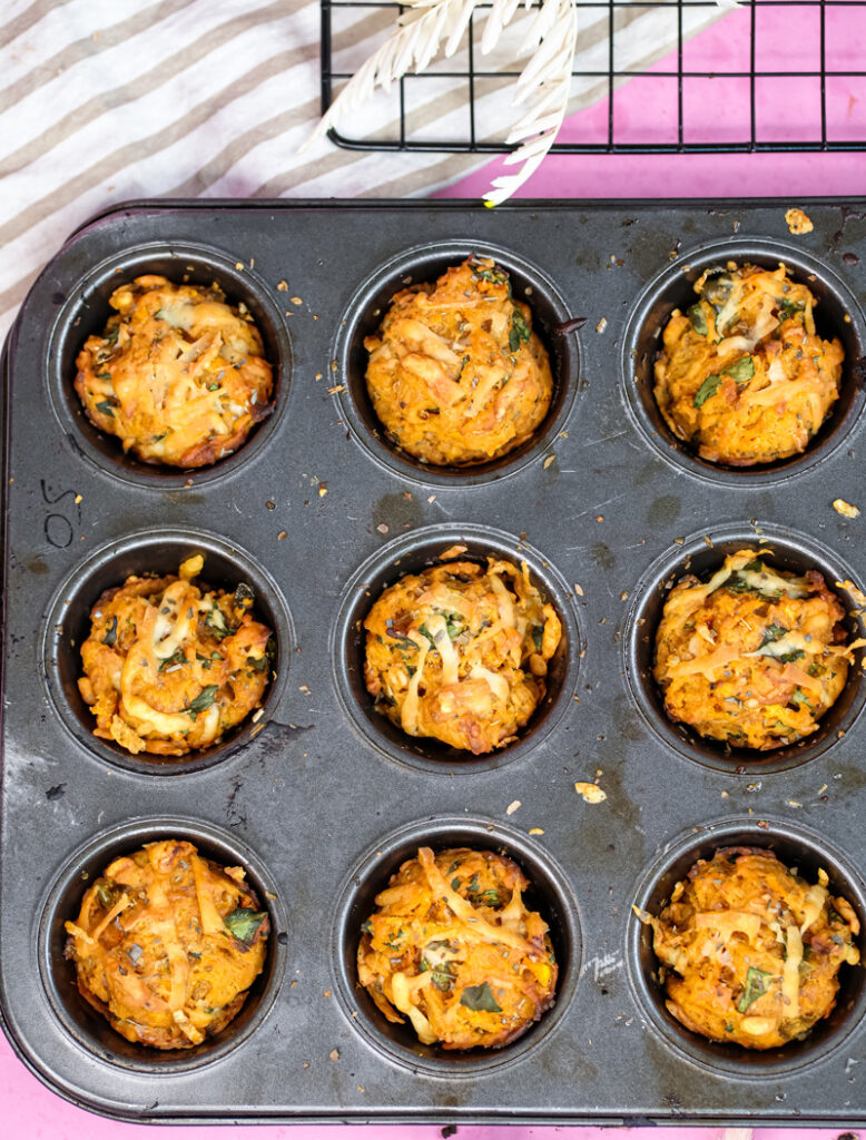 Golden baked pizza muffins fresh from oven in muffin tin