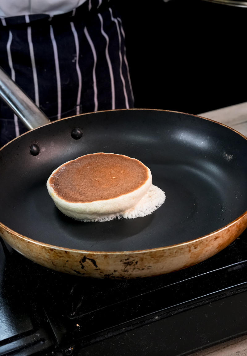 Golden brown Japanese pancake in frying pan