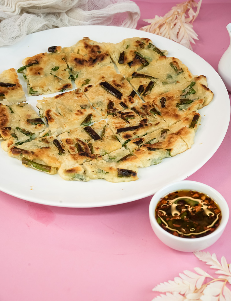 Korean scallion pancake served with spicy dipping sauce