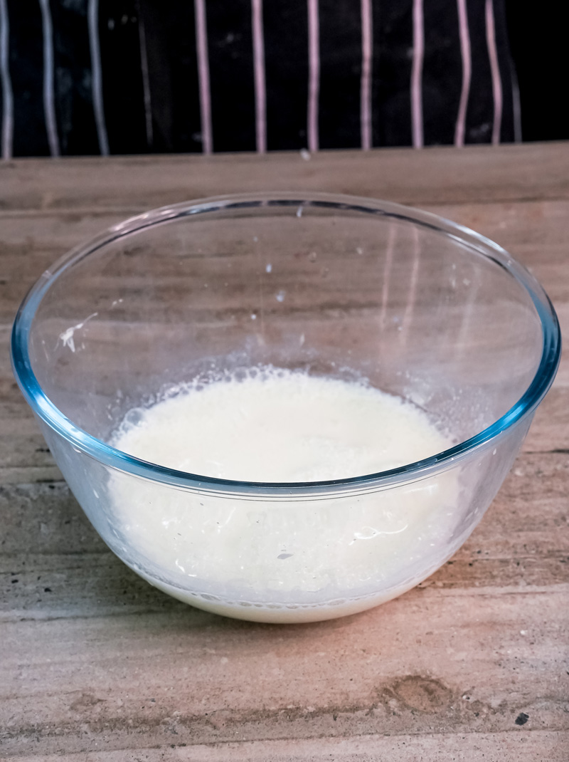 Milk in glass bowl for red velvet pancake batter