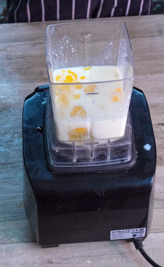 Mixed Dutch baby pancake batter with visible egg pieces