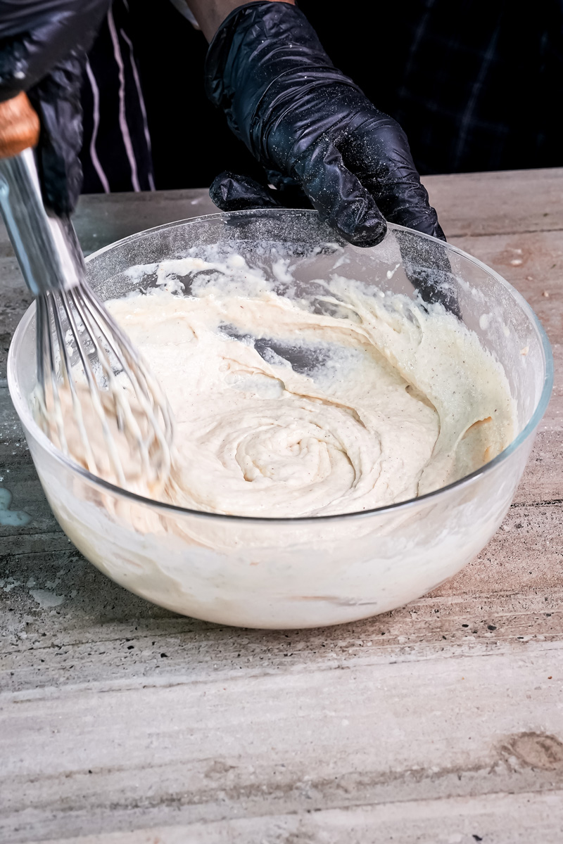 Mixing whole wheat pancake batter with whisk until smooth