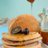 Fluffy oat pancakes with honey drizzle and fresh dates