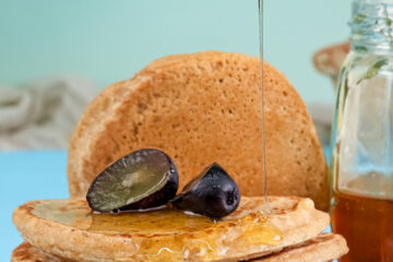 Fluffy oat pancakes with honey drizzle and fresh dates