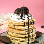 Final Oreo pancakes with generous chocolate syrup and crushed cookie topping