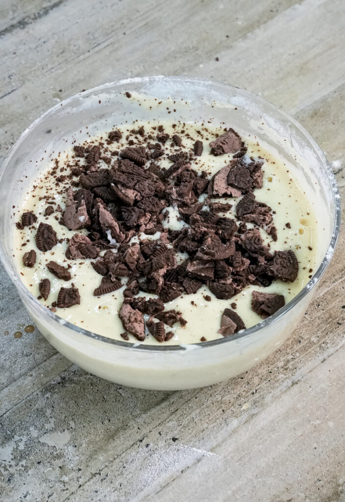 Oreo pancake batter with chocolate cookie pieces mixed in