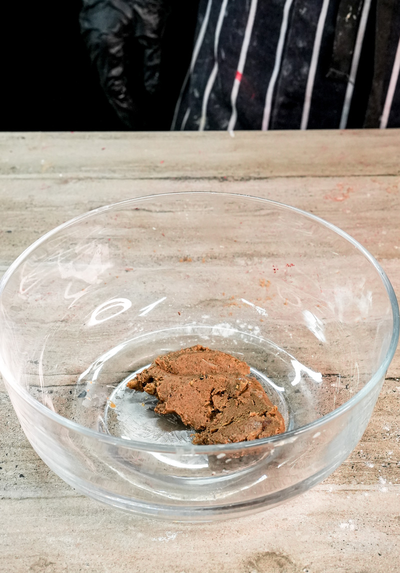 Peanut butter mixture in glass mixing bowl for pancake batter