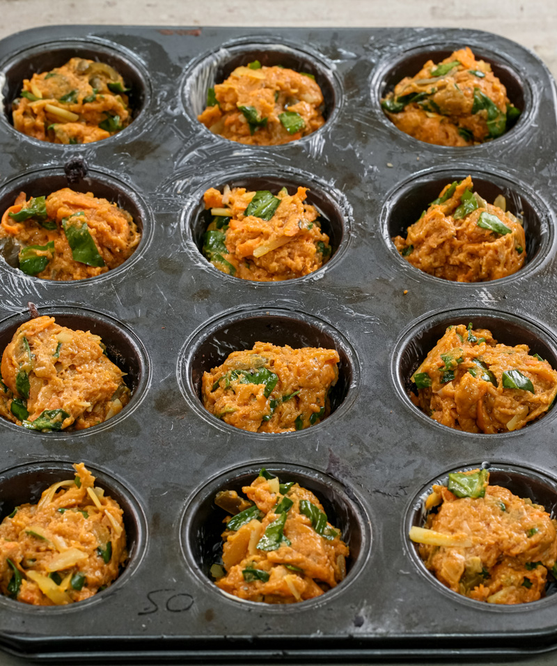 Pizza muffin batter ready for oven baking in muffin tin