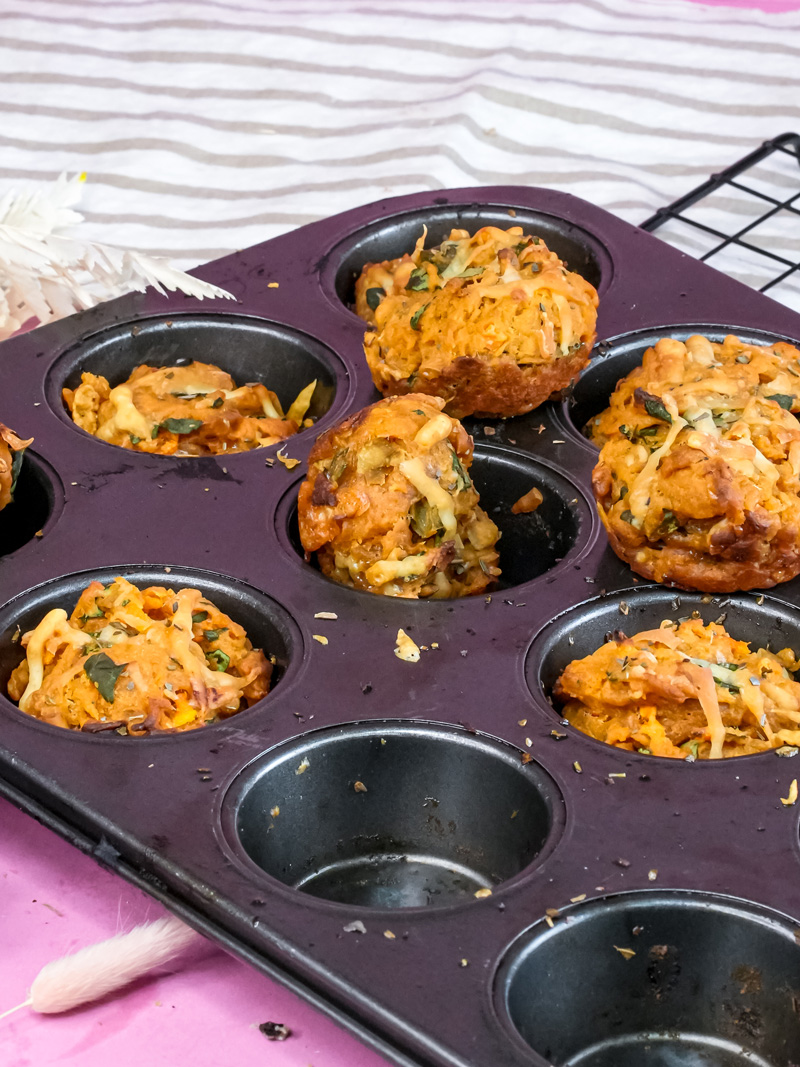 Pizza muffins cooling in muffin tin and on wire rack