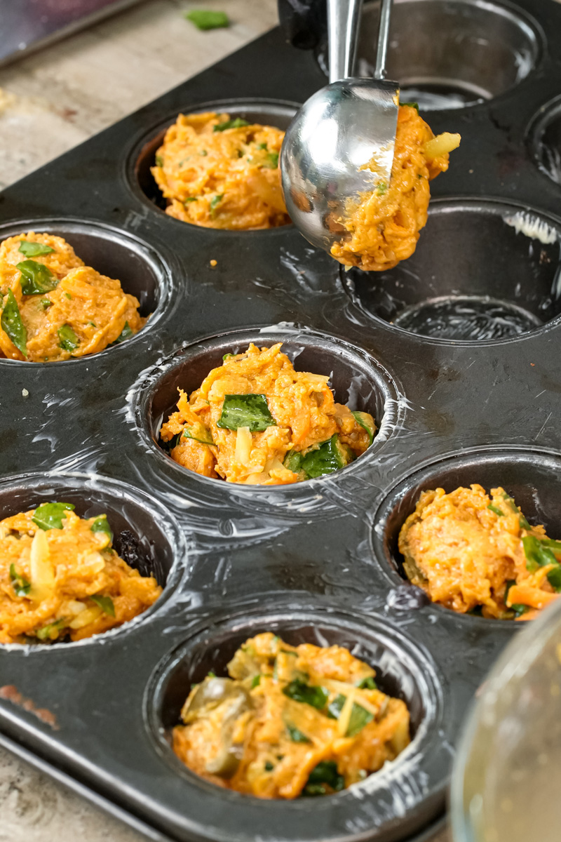 Portioning pizza muffin batter into individual muffin tin sections