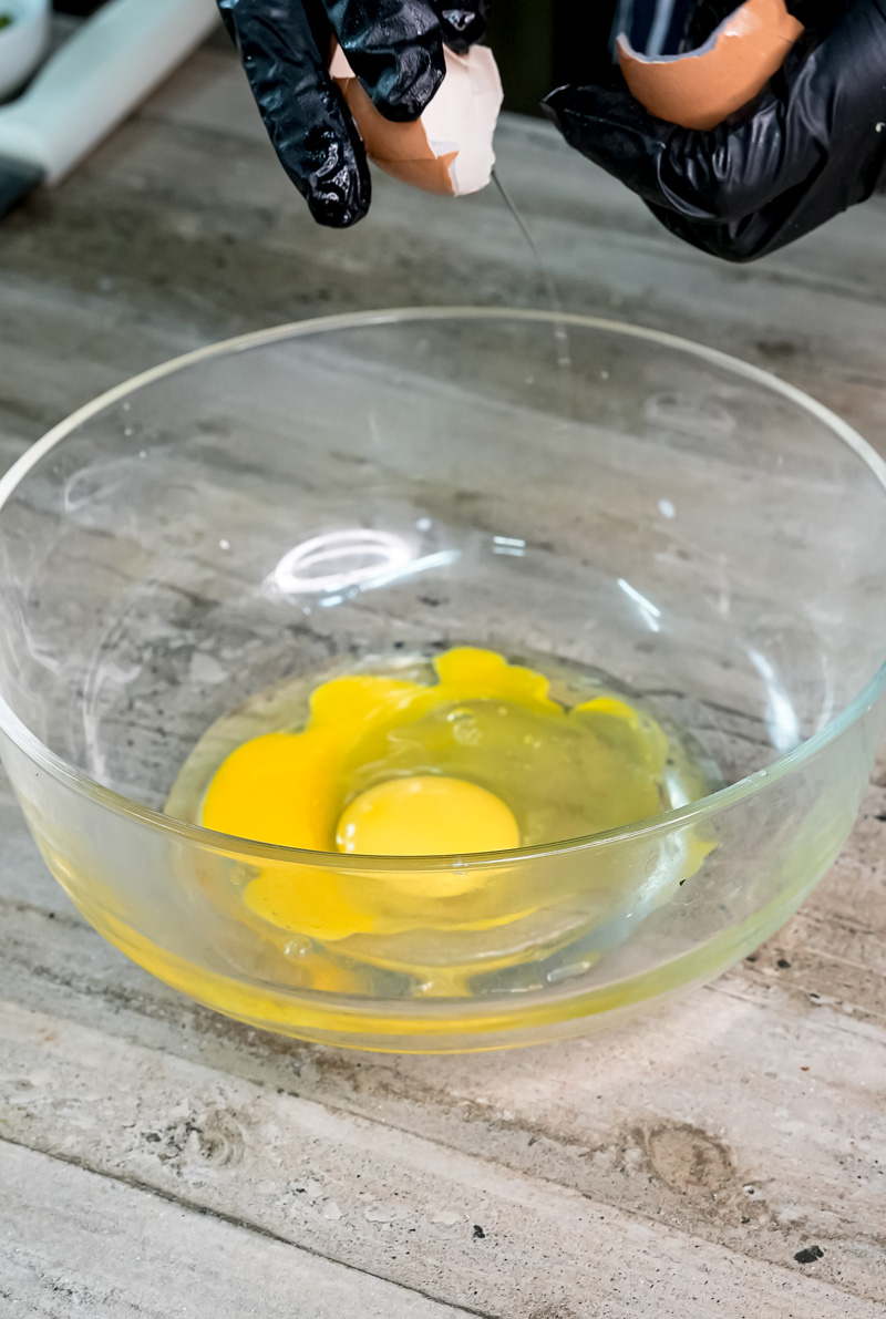 Raw eggs in glass bowl for German Apple Pancake batter