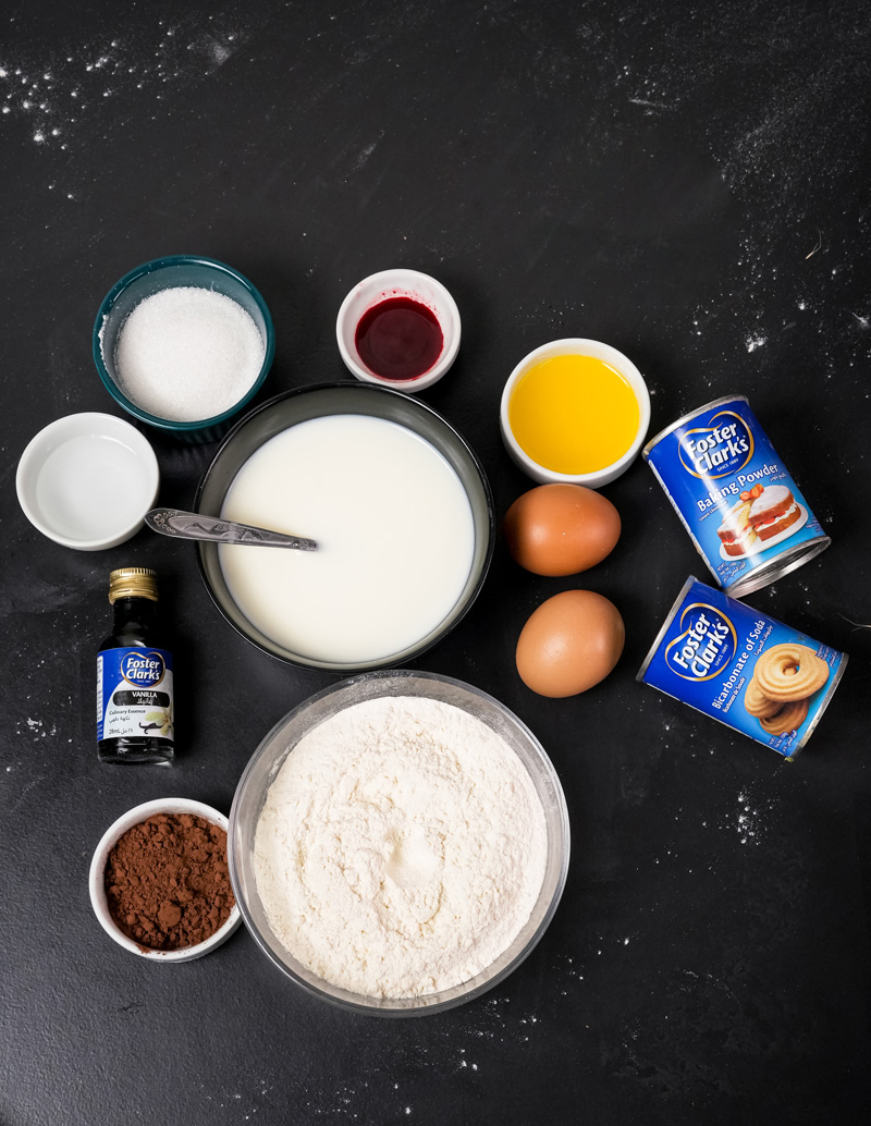 Red velvet pancake ingredients including flour, eggs, milk, vanilla, and cocoa powder