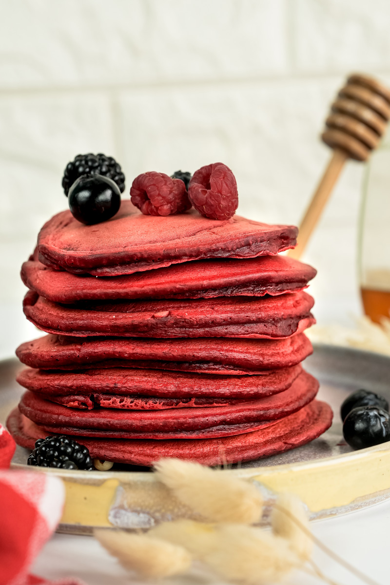 Red velvet pancakes garnished with mixed berries