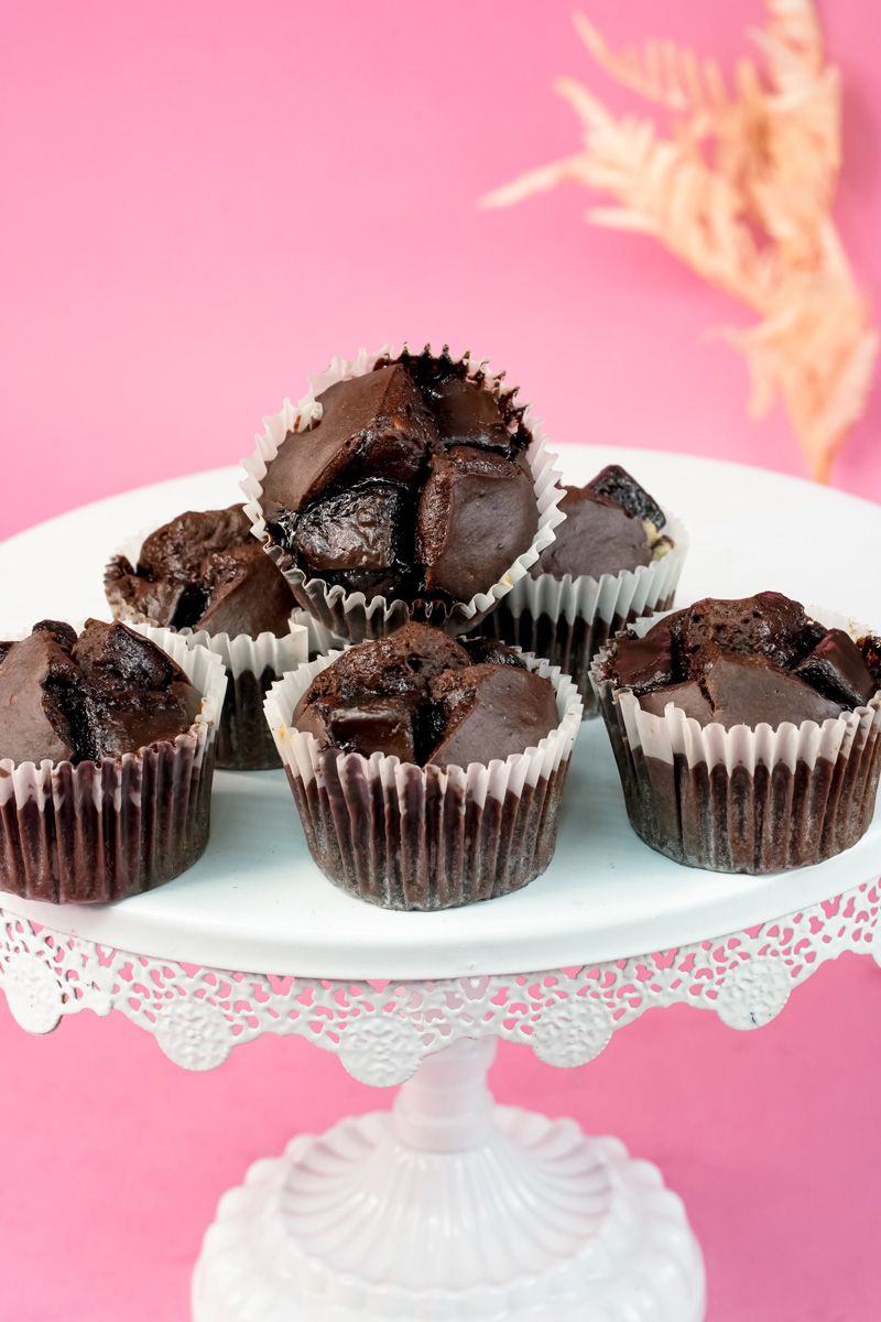Stack of rich peanut butter banana muffins on serving stand