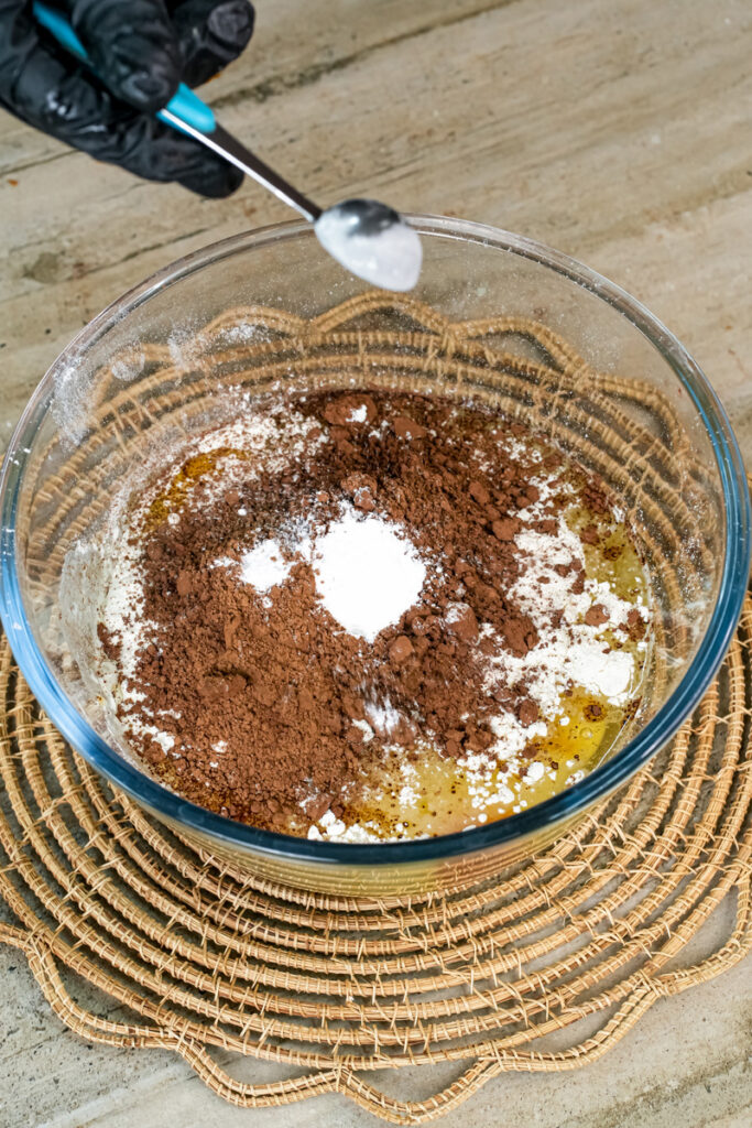 Stirring chocolate peanut butter banana muffin batter