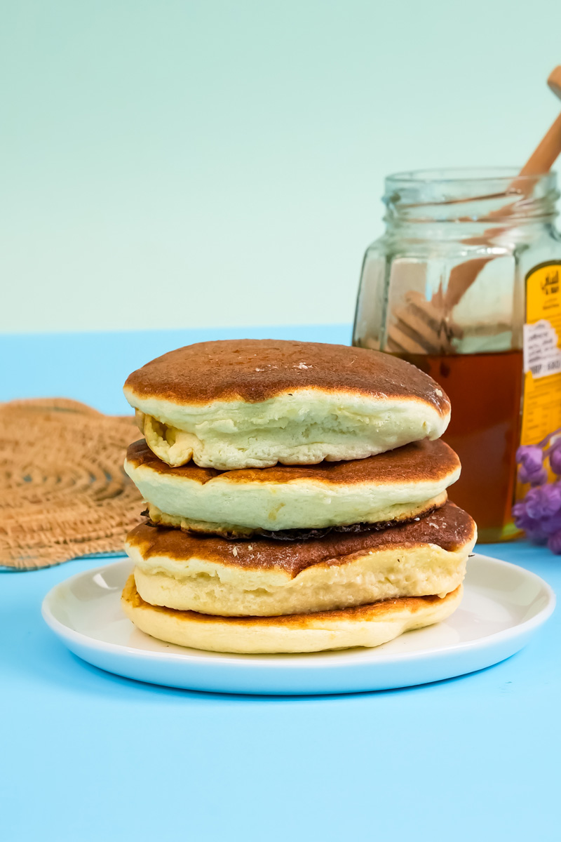 Thick Japanese soufflé pancakes stacked and ready to serve