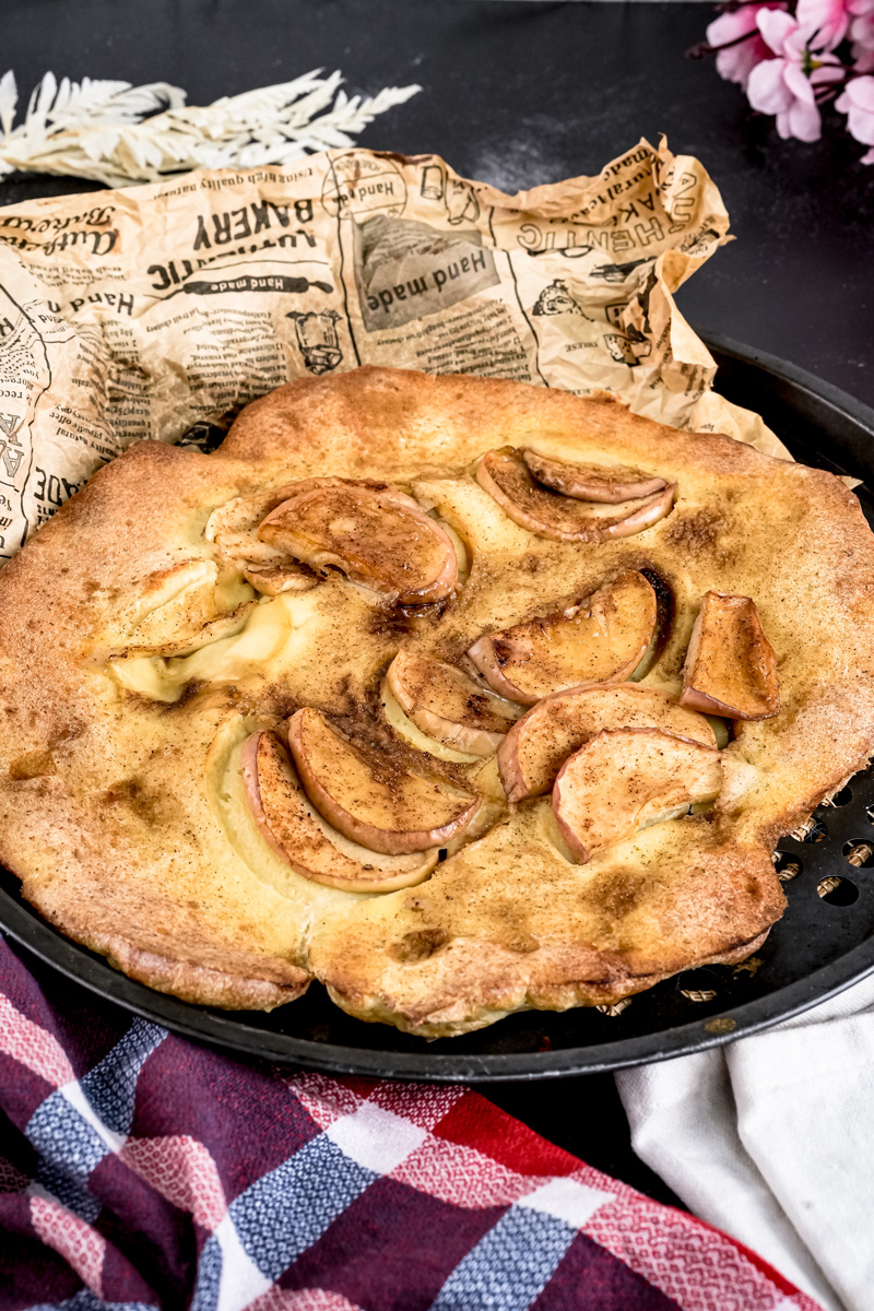 Close-up of fluffy German Apple Pancake with tender apples
