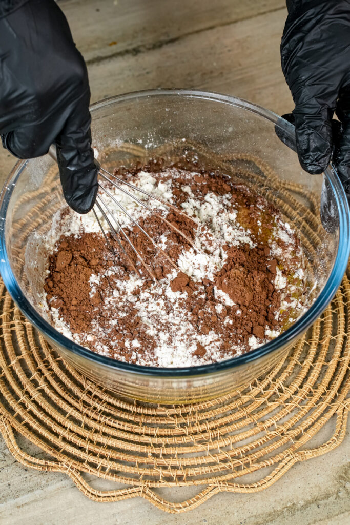 Whisking chocolate muffin batter until combined