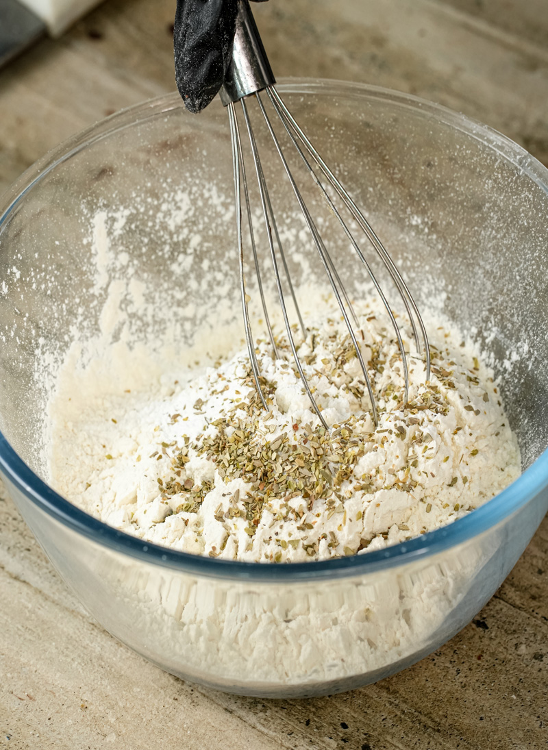 Whisking dry ingredients for pizza muffin recipe