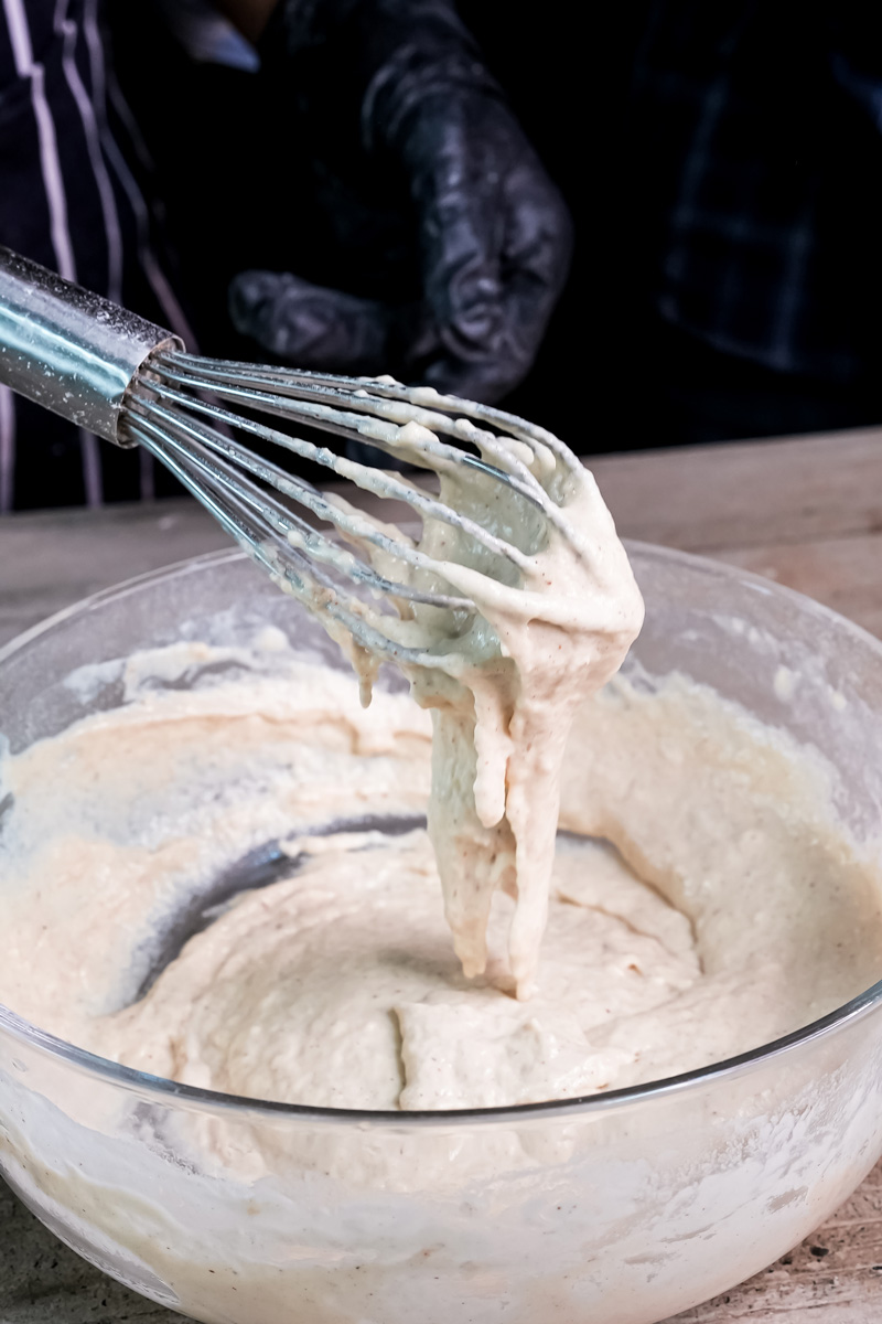 Whisking wet ingredients for homemade whole wheat pancakes
