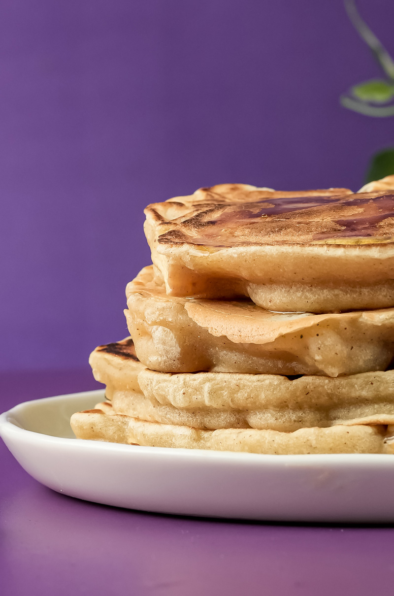 Close-up side view of apple cinnamon pancake stack
