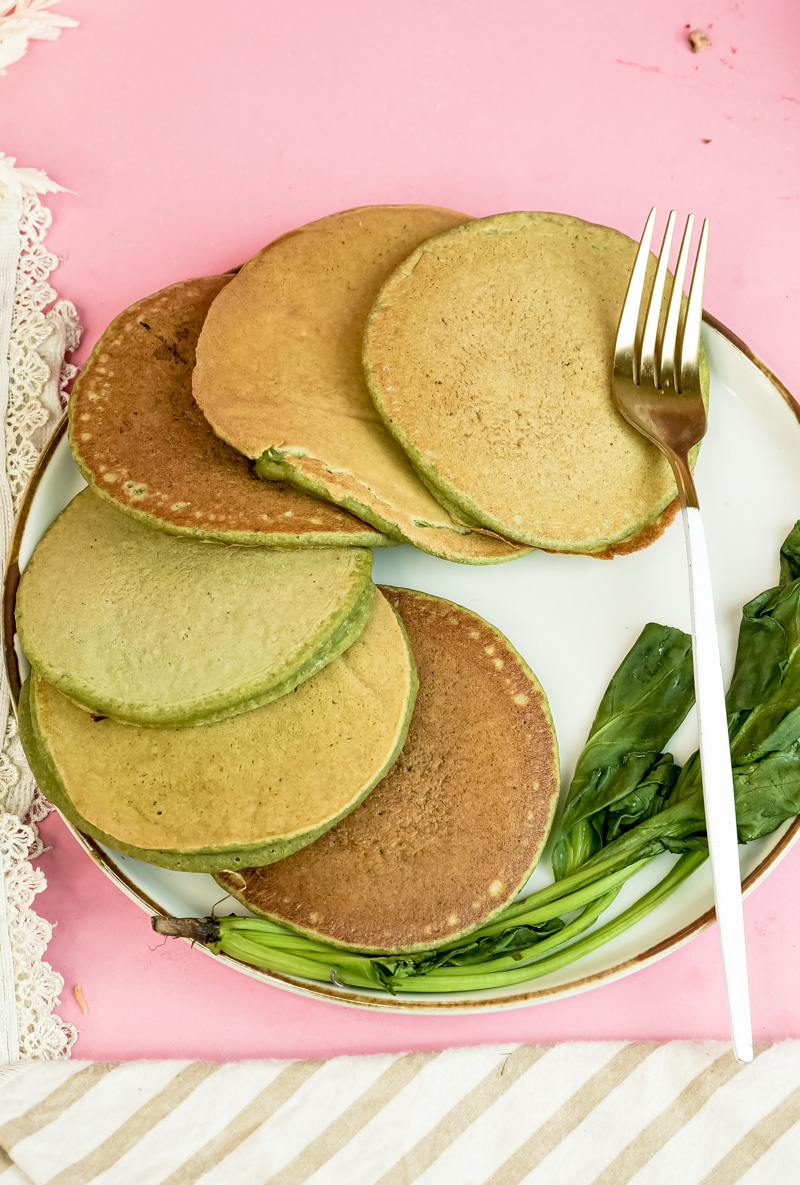 Overhead view of banana spinach pancakes on elegant plate