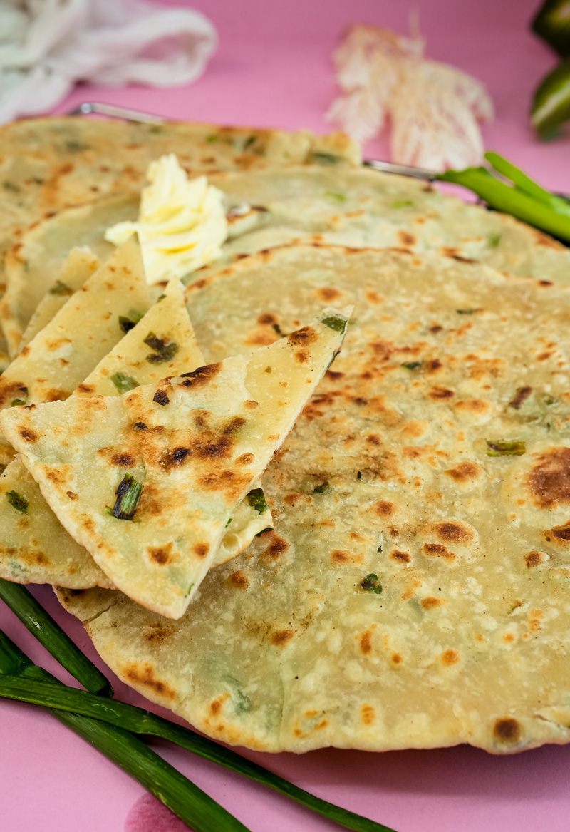 Final close-up of crispy scallion pancakes with golden brown spots