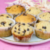 Freshly baked mini chocolate chip muffins with decorative ribbons