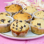 Freshly baked mini chocolate chip muffins with decorative ribbons