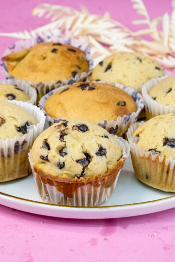 Freshly baked mini chocolate chip muffins with decorative ribbons