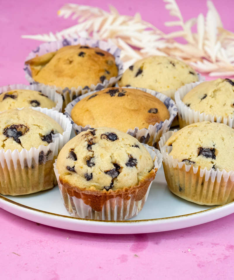 Freshly baked mini chocolate chip muffins with decorative ribbons