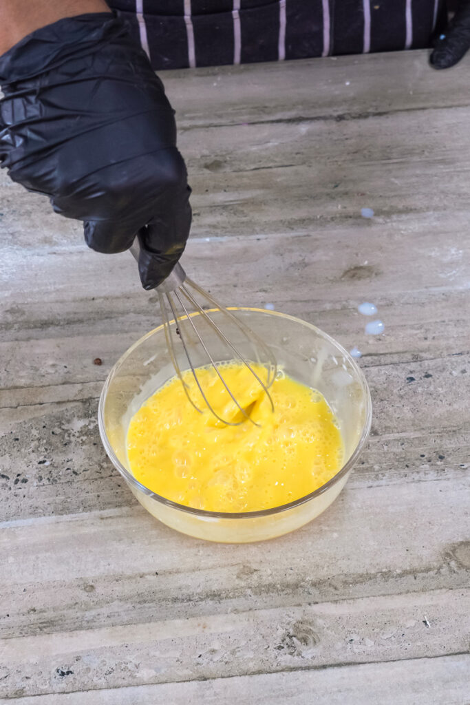 Gently whisking Japanese pancake batter to maintain fluffiness
